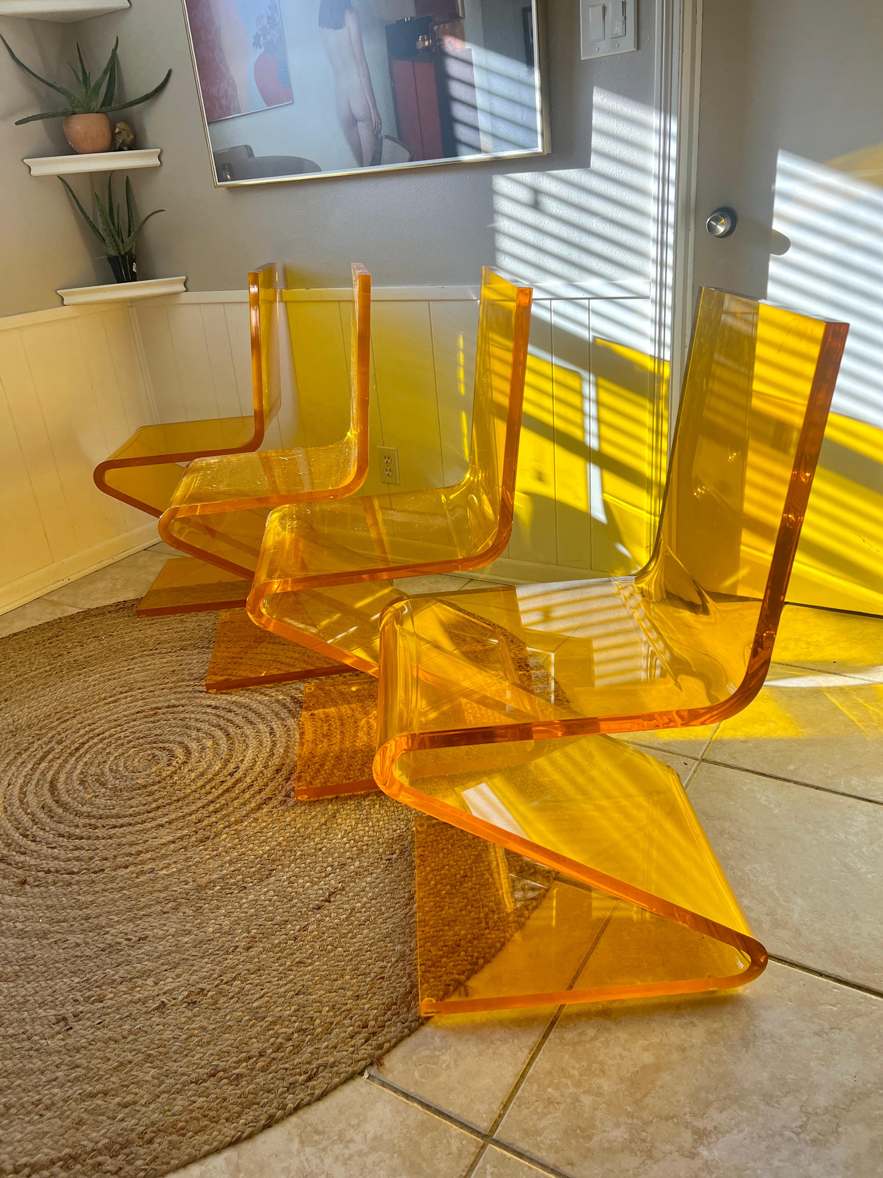 A set of four Z chairs by Haziza in a 1” thick lucite orange color For Sale 3