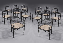 Set of Fourteen Anglo Indian Regency Ebony Armchairs