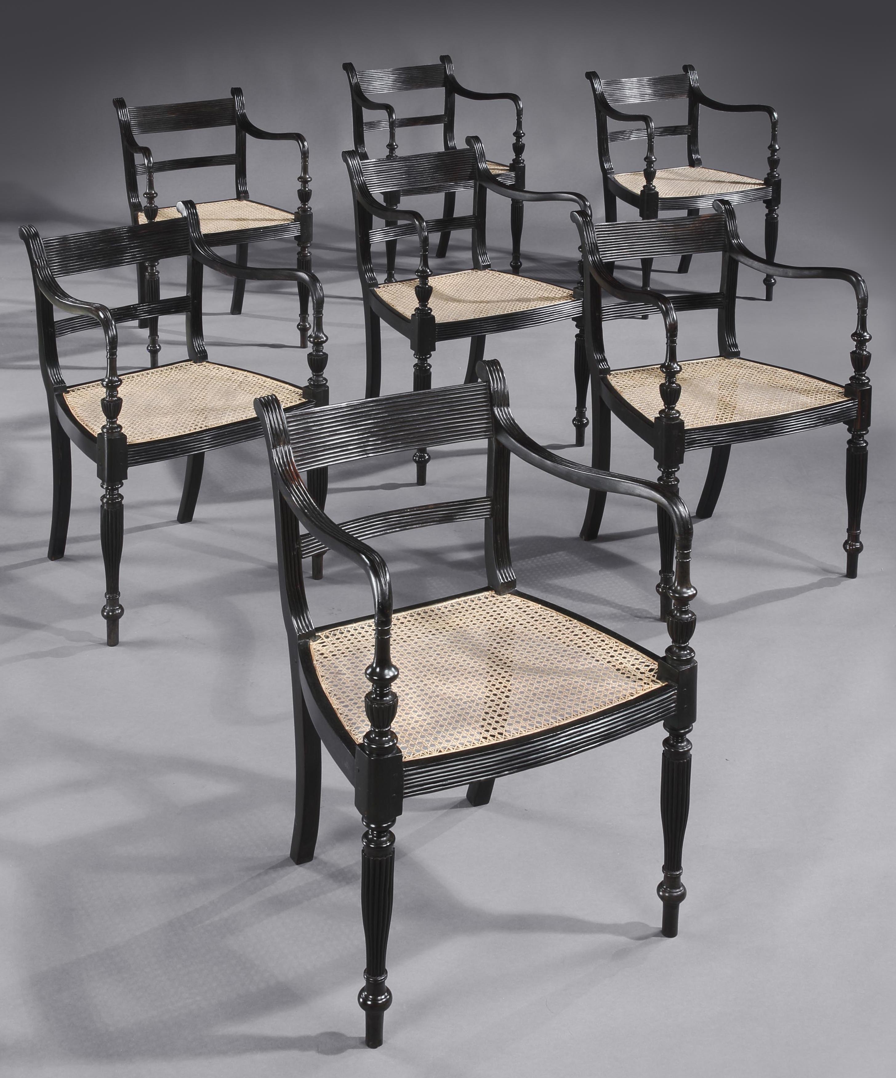 Carved Set of Fourteen Anglo Indian Regency Ebony Armchairs For Sale