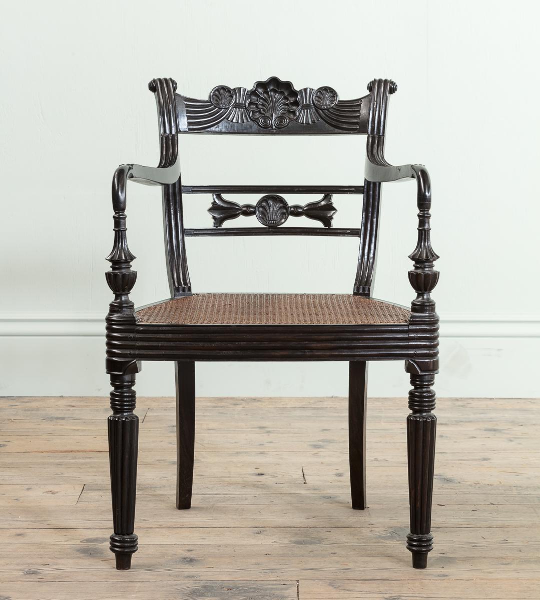 A Set of Fourteen Early 19th Century Anglo Indian Carved Ebony Armchairs

All carved with elbow arms, with caned seats and overall dry ebony surface.

Height: 83.5 cm
Width: 57 cm
Depth: 51 cm