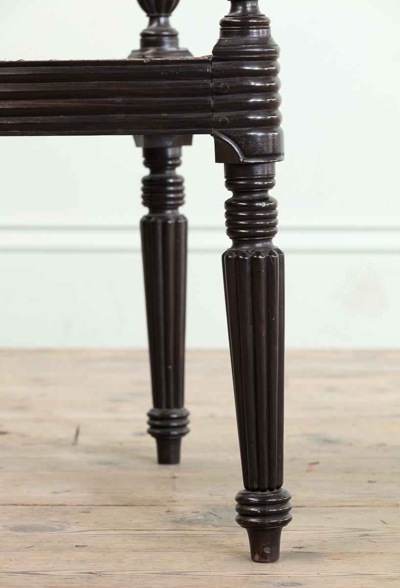Caning A Set of Fourteen Early 19th Century Anglo Indian Carved Ebony Armchairs For Sale