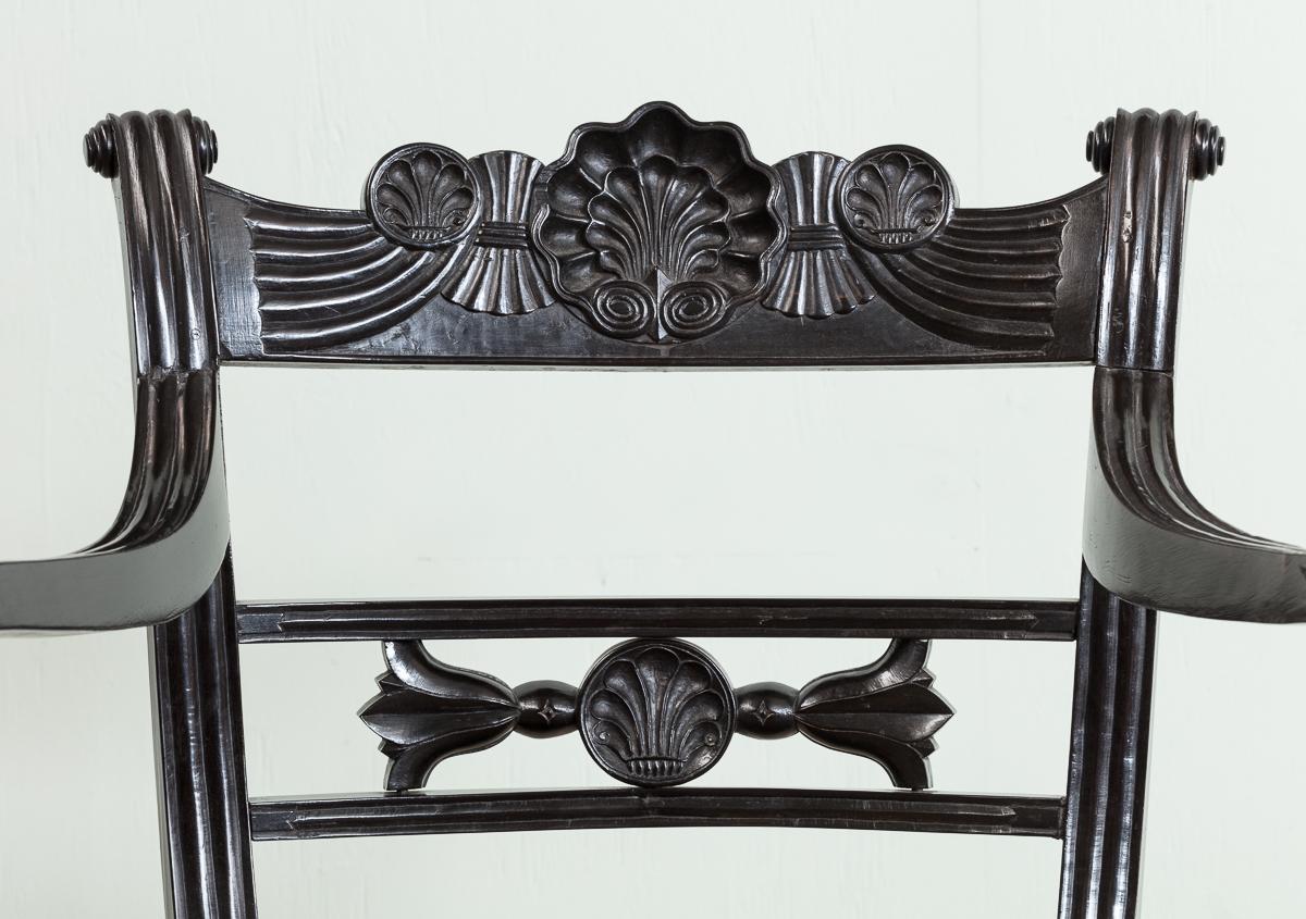 A Set of Fourteen Early 19th Century Anglo Indian Carved Ebony Armchairs For Sale 1