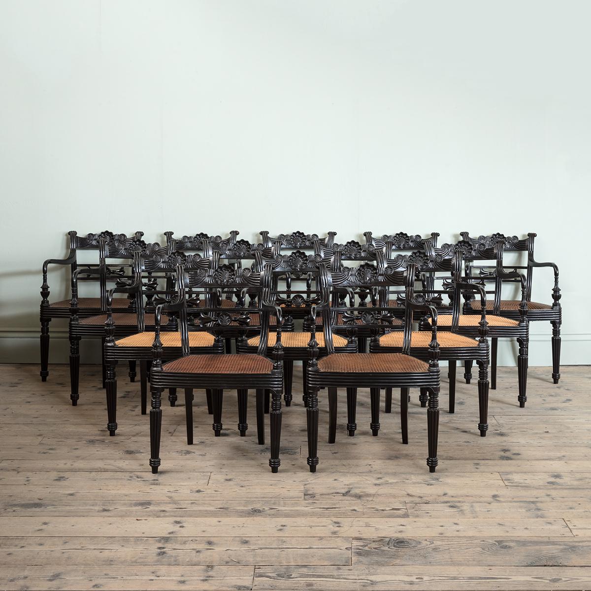 A Set of Fourteen Early 19th Century Anglo Indian Carved Ebony Armchairs For Sale 2