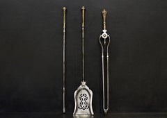 A Set of Georgian Style Brass and Steel Firetools