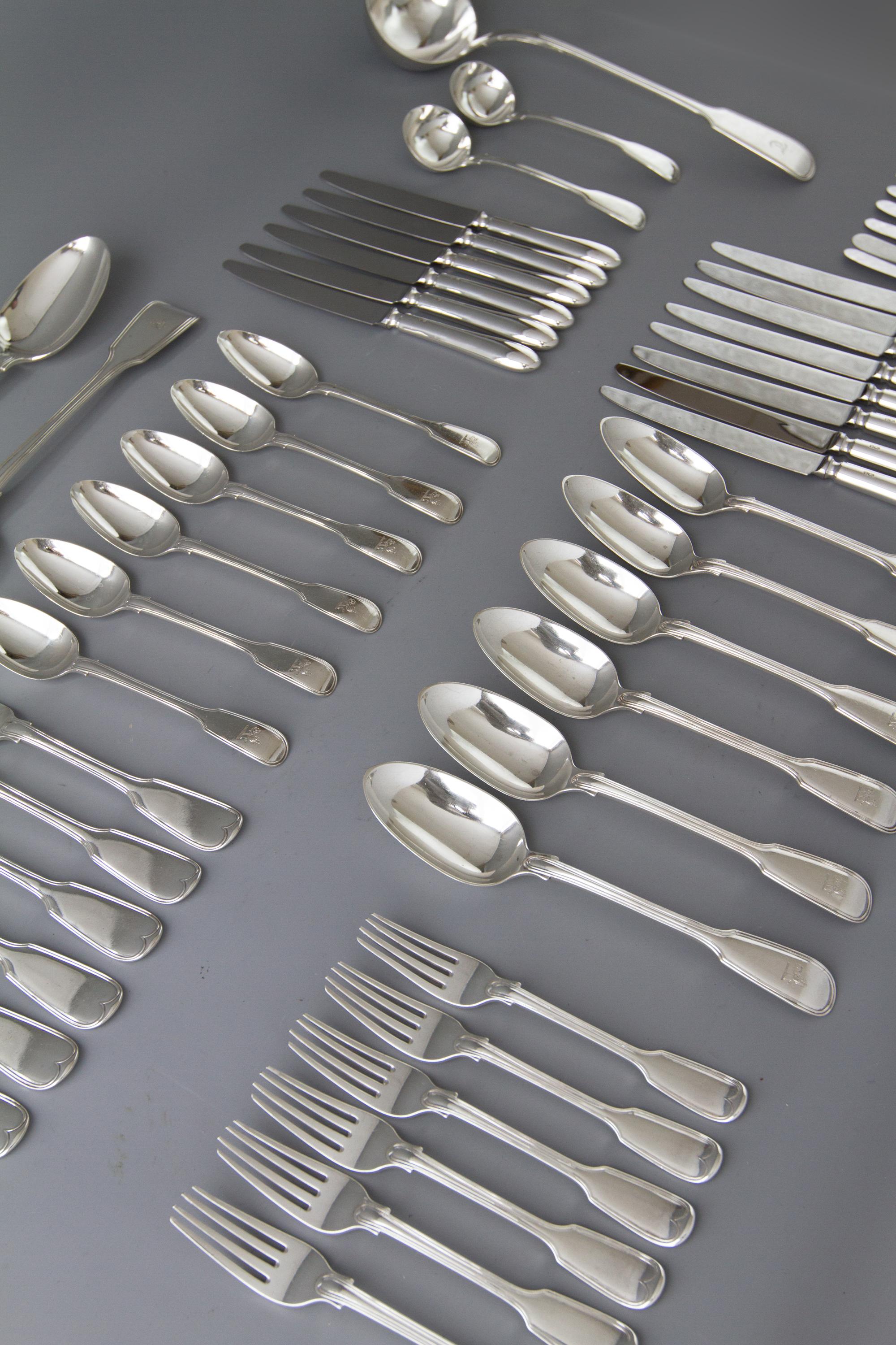 A very good part silver table service or canteen for six people in fiddle and thread pattern, consisting of six serving or tablespoons, six table forks, six dessert forks, six dessert spoons, eight dinner knives, six dessert knives, six butter