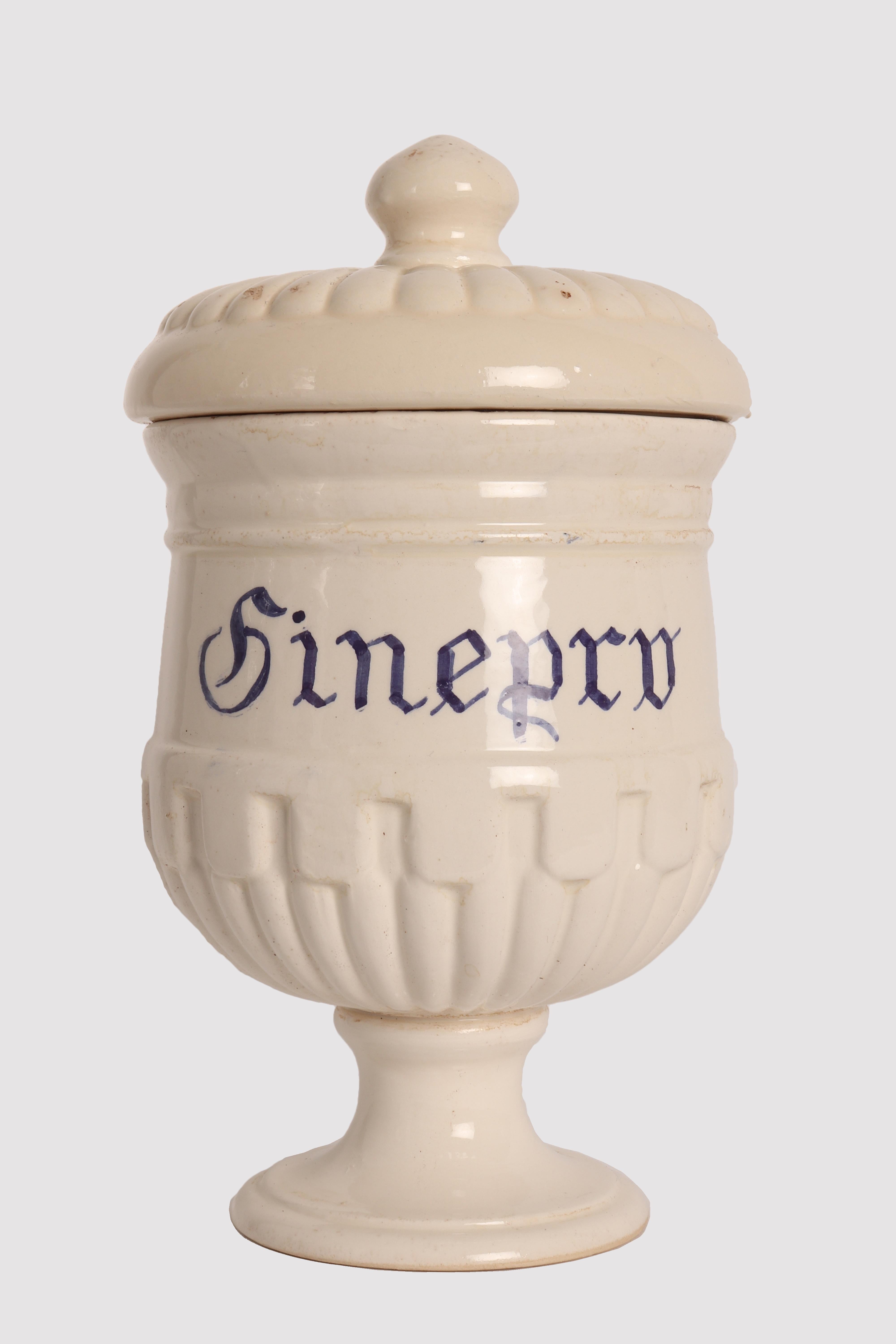 Set of five small jars with lid for pharmacy-herbalist's shop in white ceramic with cobalt blue inscriptions, to contain Juniper, Willow, Gentian, Verbena, Brown seaweed of neoclassical taste with geometric decorations in relief. Unidentified brand.