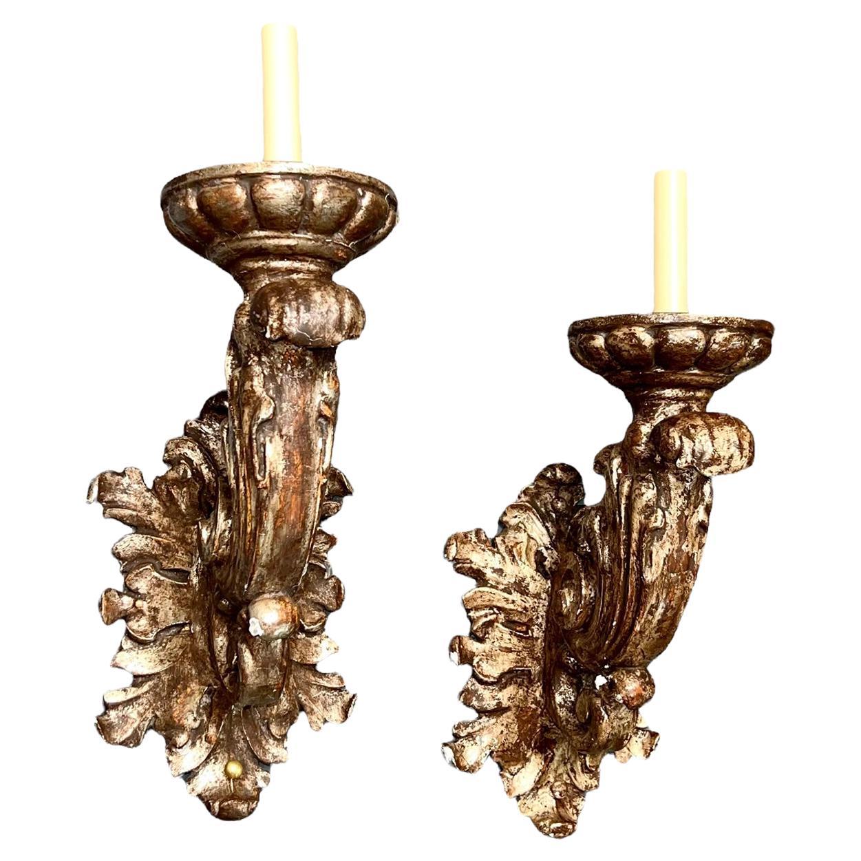 A set of ten Italian circa 1920's wood sconces with silver leaf finish. Sold per pair

Measurements:
Height: 19
