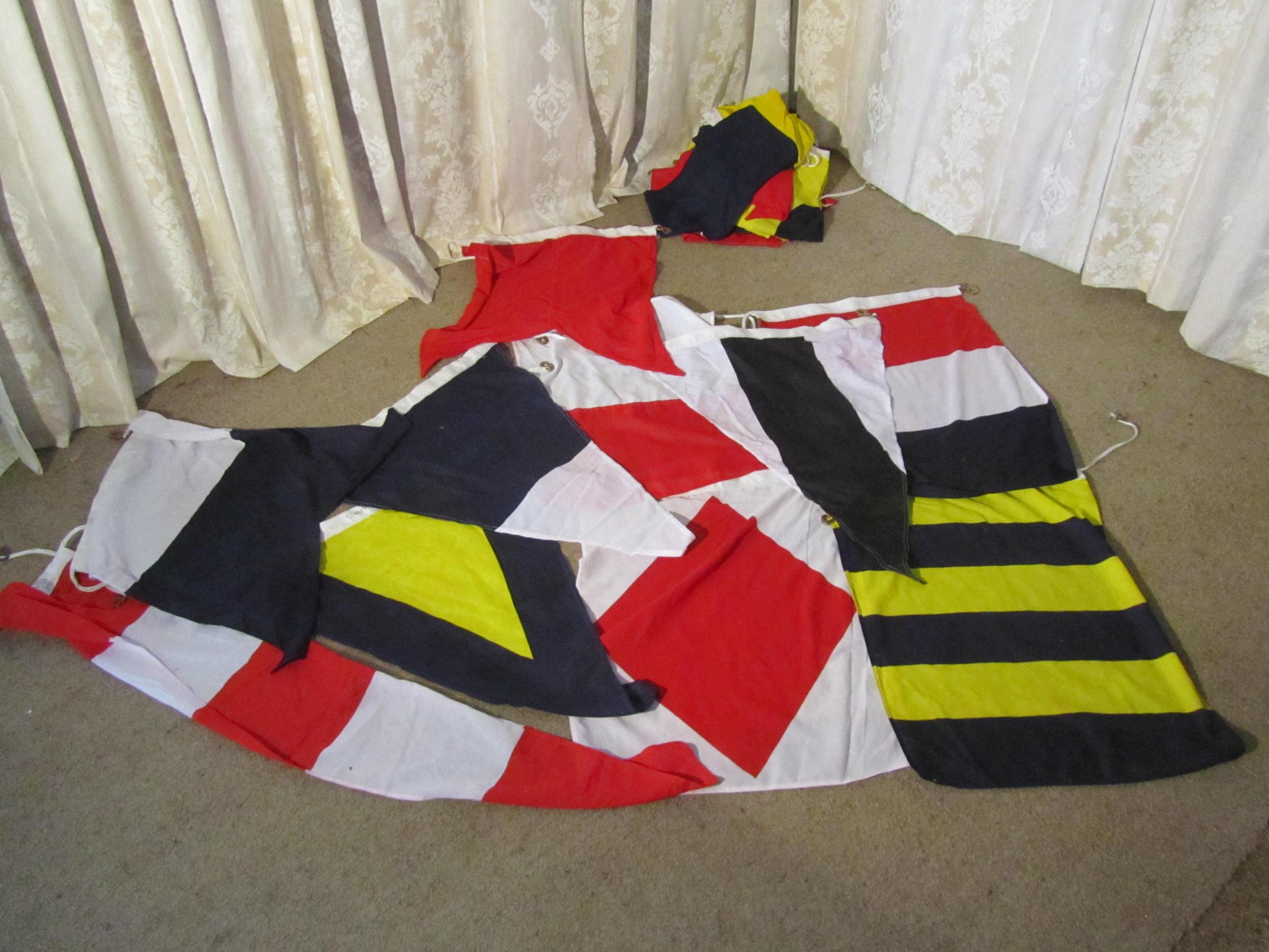 Set of Maritime 43 large signalling flags

There are 43 flags in this set, they are reputed to have come from Portsmouth Dock Yard and all in very good condition, the flags are all traditionally sewn linen and almost unused, with brass