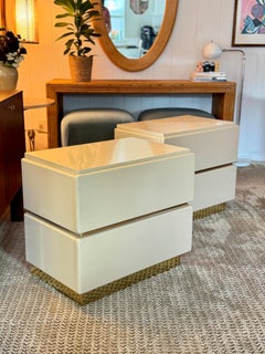 A set of postmodern cream lacquer & brass nightstands by Lane, circa 1980s