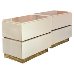 A set of postmodern cream lacquer & brass nightstands by Lane, circa 1980s