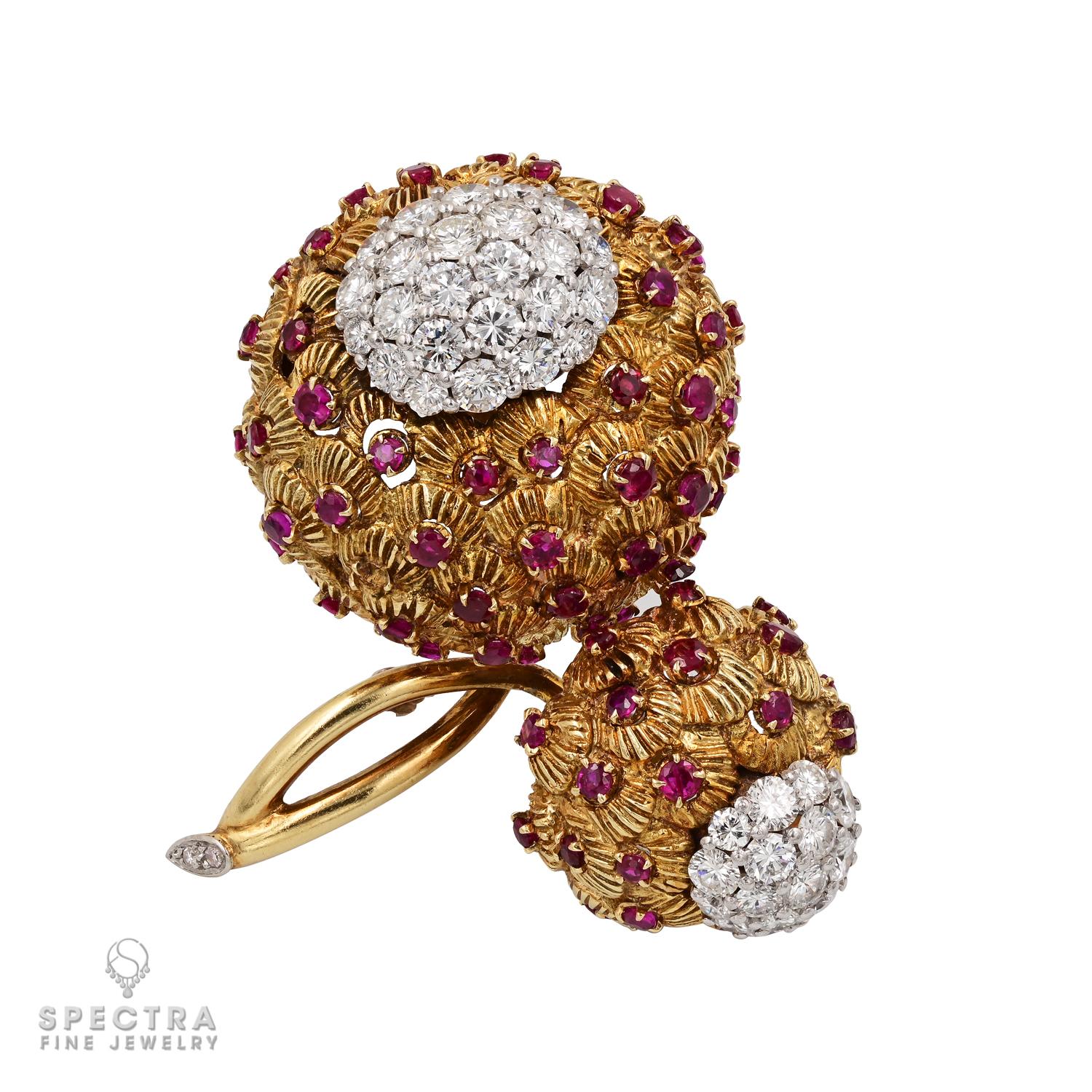 A visually intriguing mix of design details comes together in this Contemporary Diamond and Ruby Demi Parure Suite, comprised of three thematically related pieces - a pair of ear clips, a brooch, and a ring, each of bombe design. Although made in