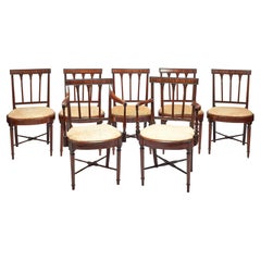 A set of seven George III mahogany dining chairs 