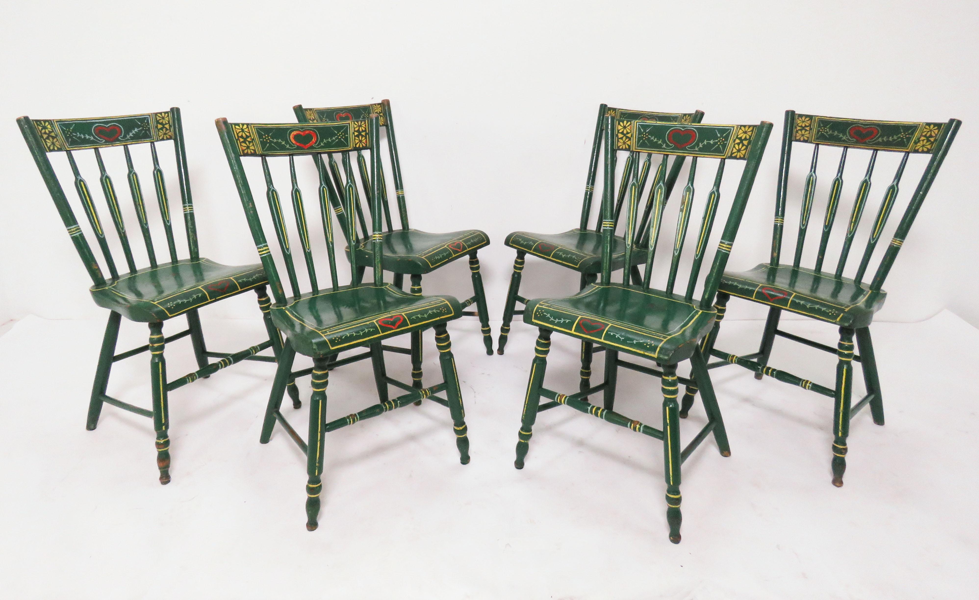 A set of six 19th century Pennsylvania Windsor chairs, embellished in the German Folk Art tradition of Lancaster County. A rare set found intact in their original Bauernmalerei (literally, farmer’s painting) decoration. Though the chairs themselves