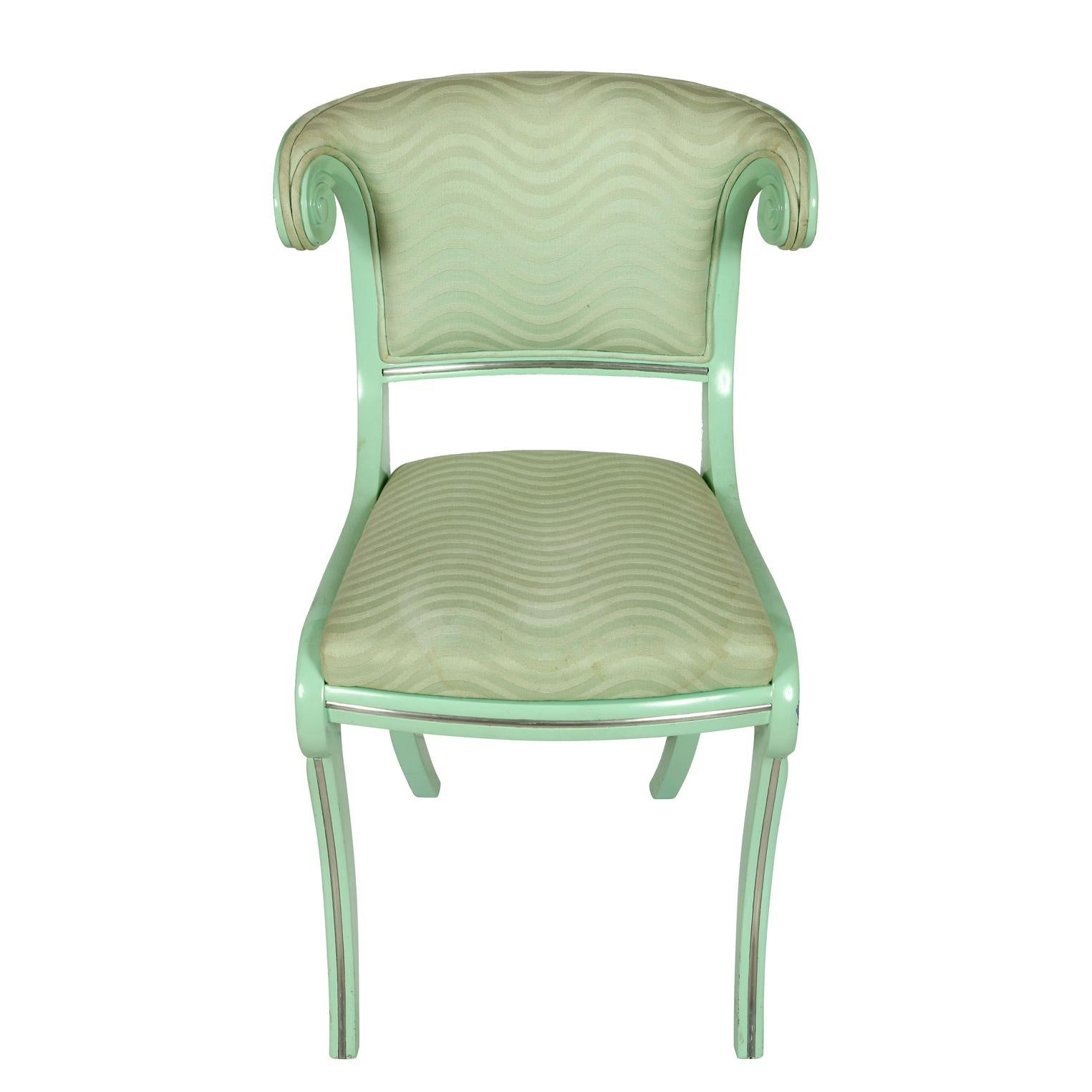A set of six aqua lacquered klismos style dining chairs with twist details to back. Upholstered seats and back.