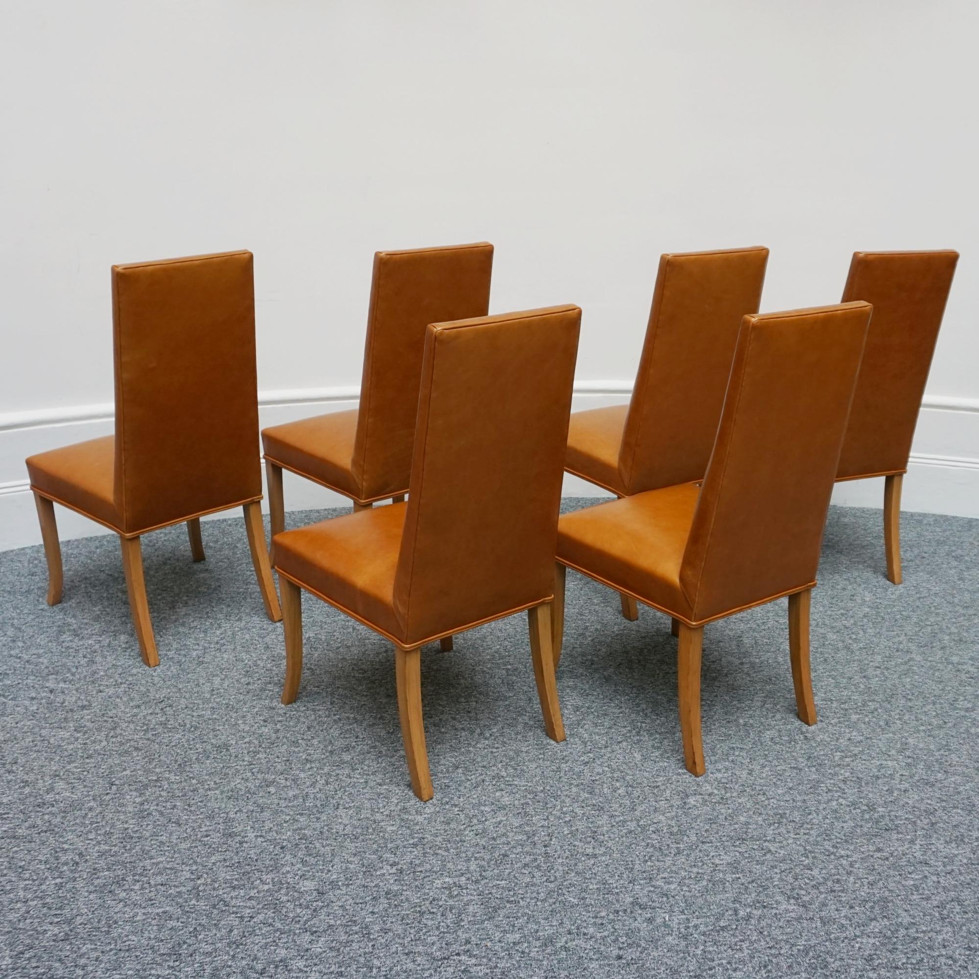 A set of six Art Deco dining chairs and two carver armchairs by Hille of London. Solid walnut arms and legs with brown leather re-upholstery. 

Dimensions:  Chair H 106cm W 50cm D 50cm Seat H 46cm Carver H 109cm W 54cm D 54cm Seat H 46cm

Origin: