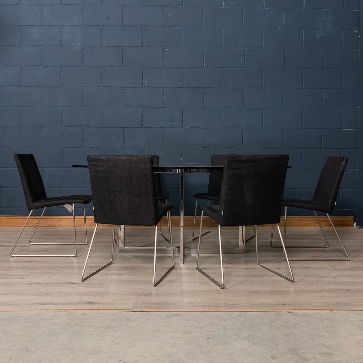 A wonderful set of six BoConcept dining room chairs, Mariposa Delight model. BoConcept is a Danish firm which designs and manufactures quality products in the spirit of Scandinavian style and elegance, all the while keeping an eye on functionality.