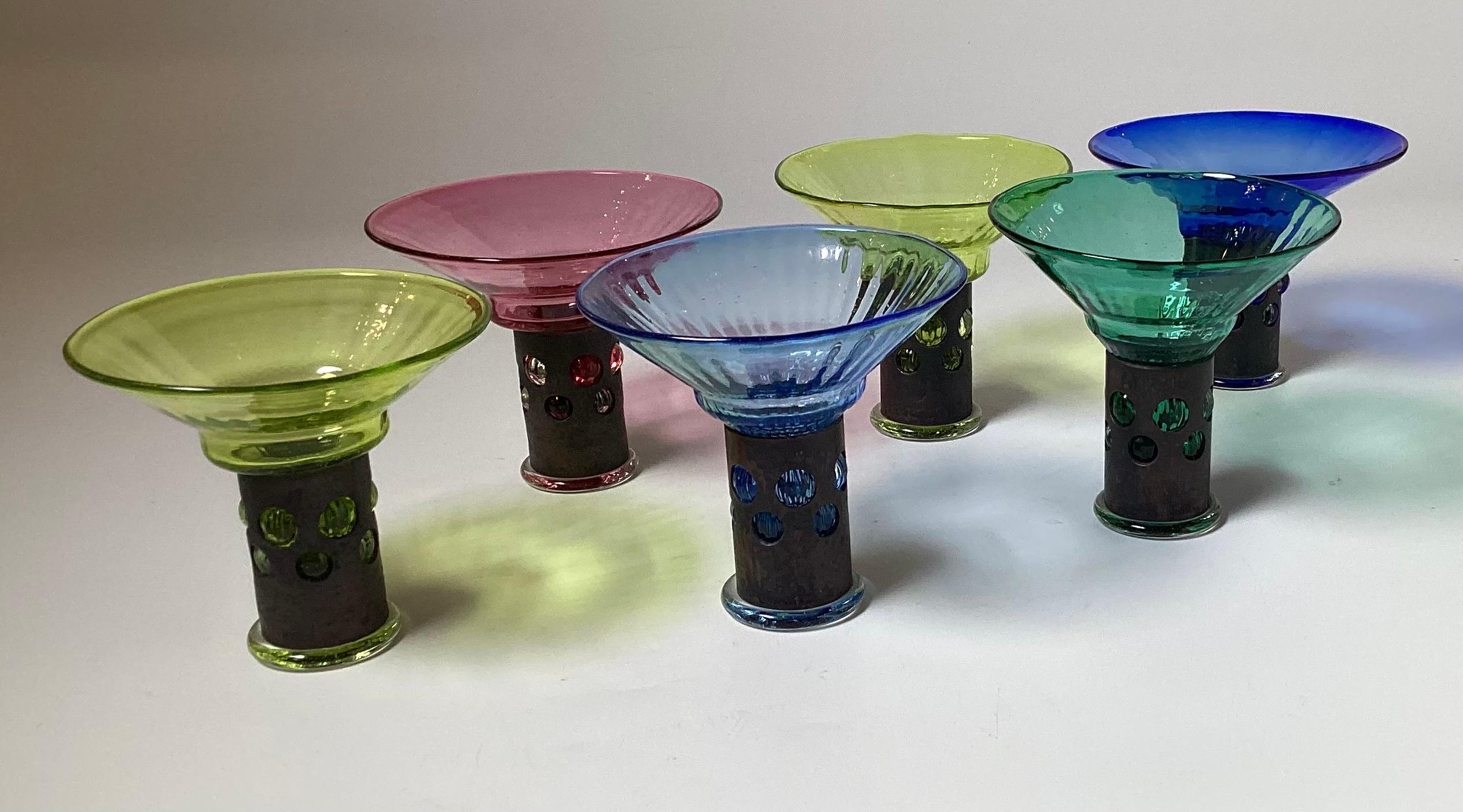 A set of 6 high style hand blown cocktail glasses in 5 colors with metal stems, hand blown by Borek Sipek.  Born in Prague, he was renowned for his individual, unusual, colorful, and rich style. He experimented with unexpected and often opulent