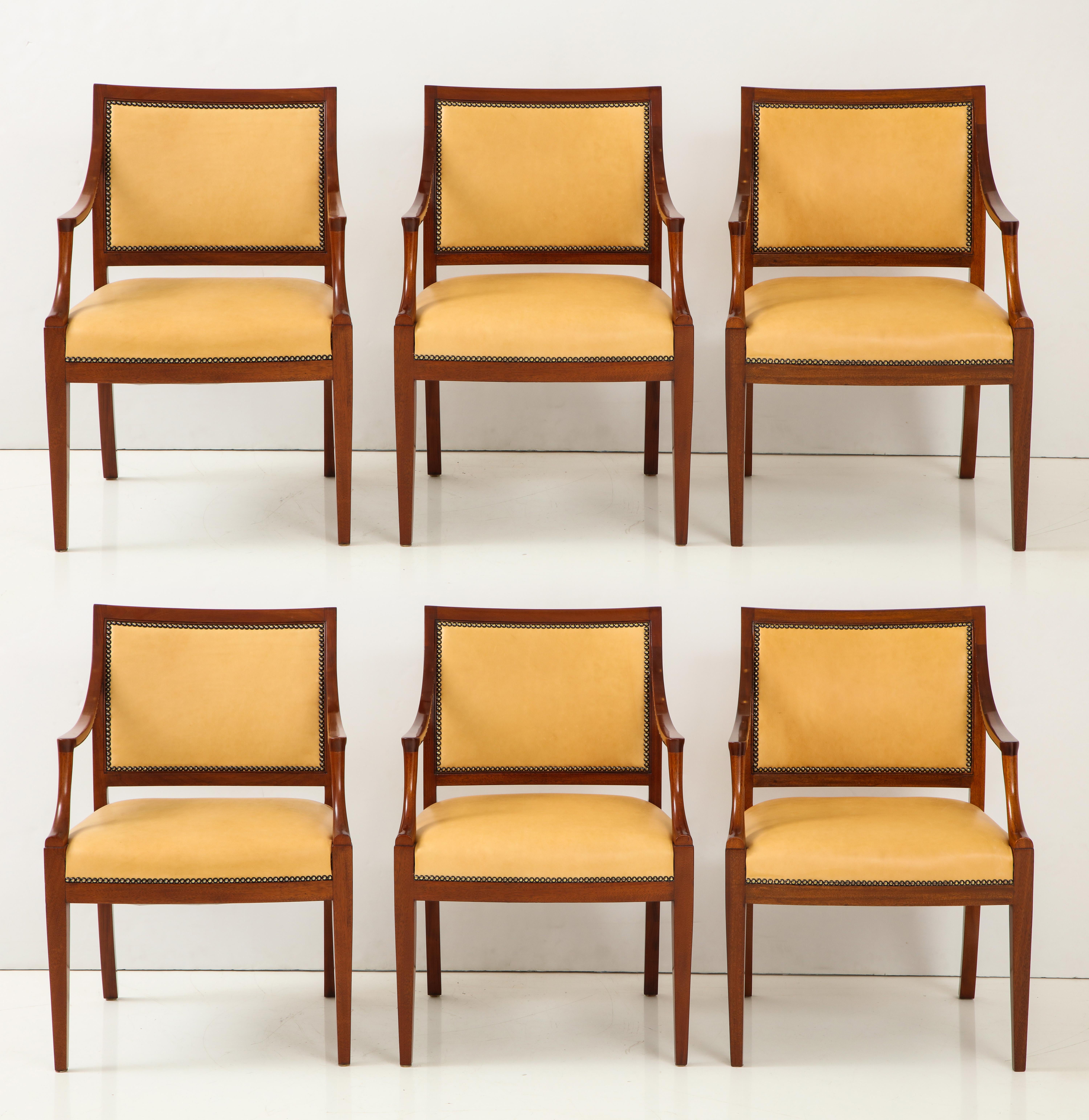 A set of Four Danish mahogany open armchairs by Frits Henningsen with leather seat and back finished with French nailheads, circa 1940s, a rich mahogany frame with downswept armrests raised on square tapered legs. New leather upholstery. 


Can be