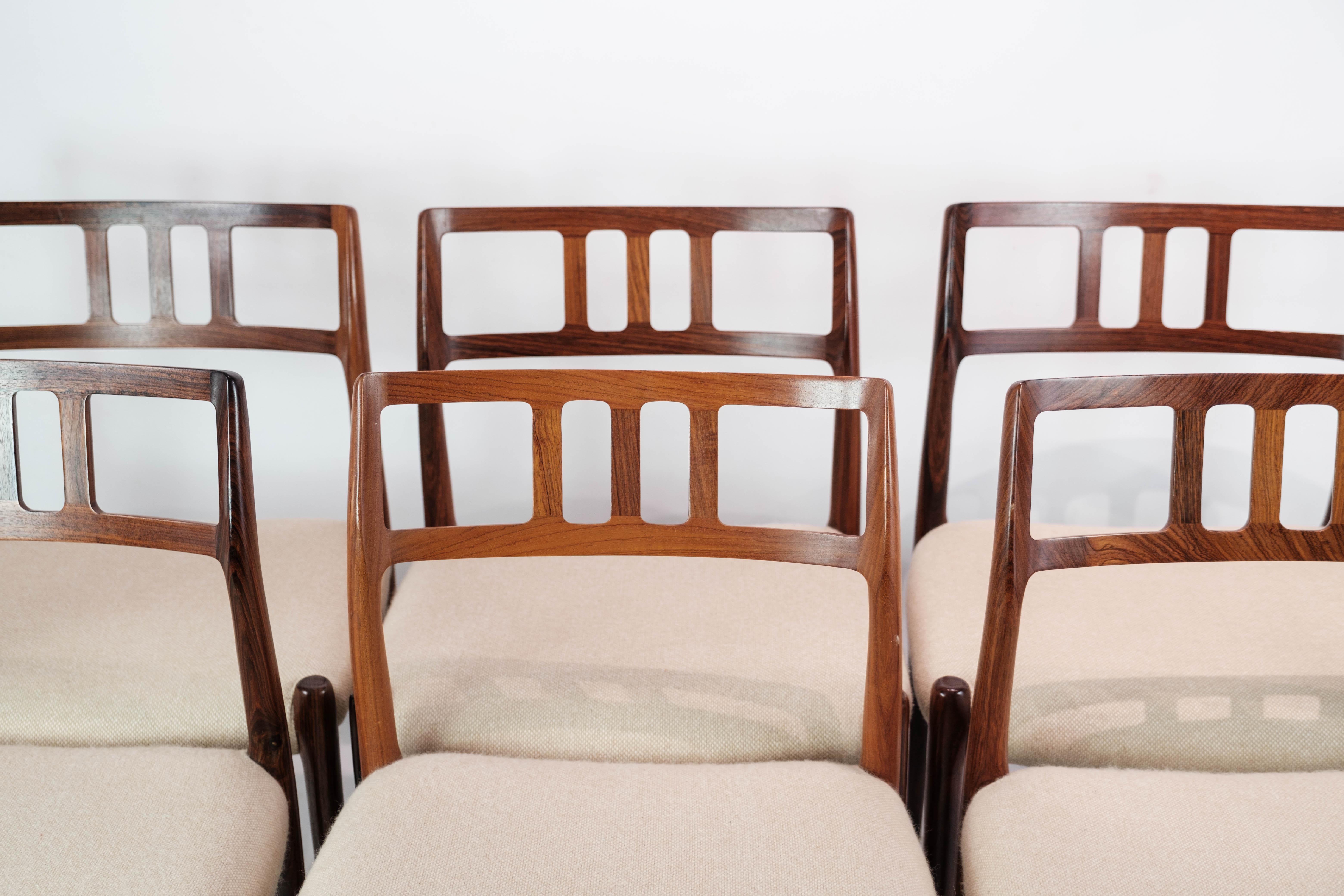 A set of six dining room chairs, model 79, designed by N.O. Moeller in 1966 and manufactured by J.L. Moeller in the late 1960s. The chairs are made of rosewood and light seats.