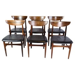 Ensemble de six chaises de table de salle à manger en bois de rose des années 1960
