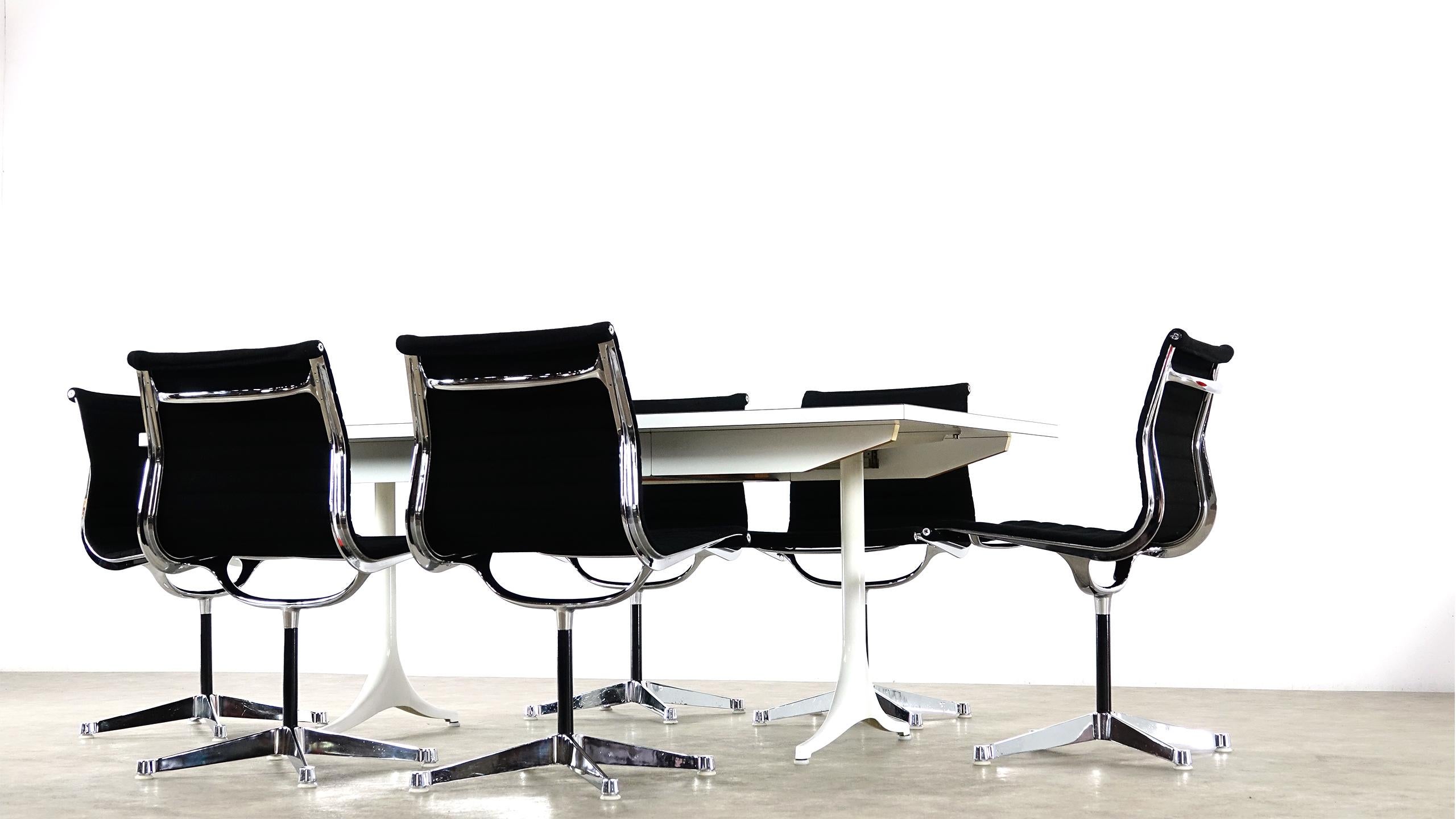 A set of six EA 105 Charles & Ray Eames office chairs for Herman Miller, 1958.

 A set of six chairs from the Aluminium Group series, model EA-105, with chromed aluminium frame and fixed base. Seat and back with black hopsack covers. Designed in