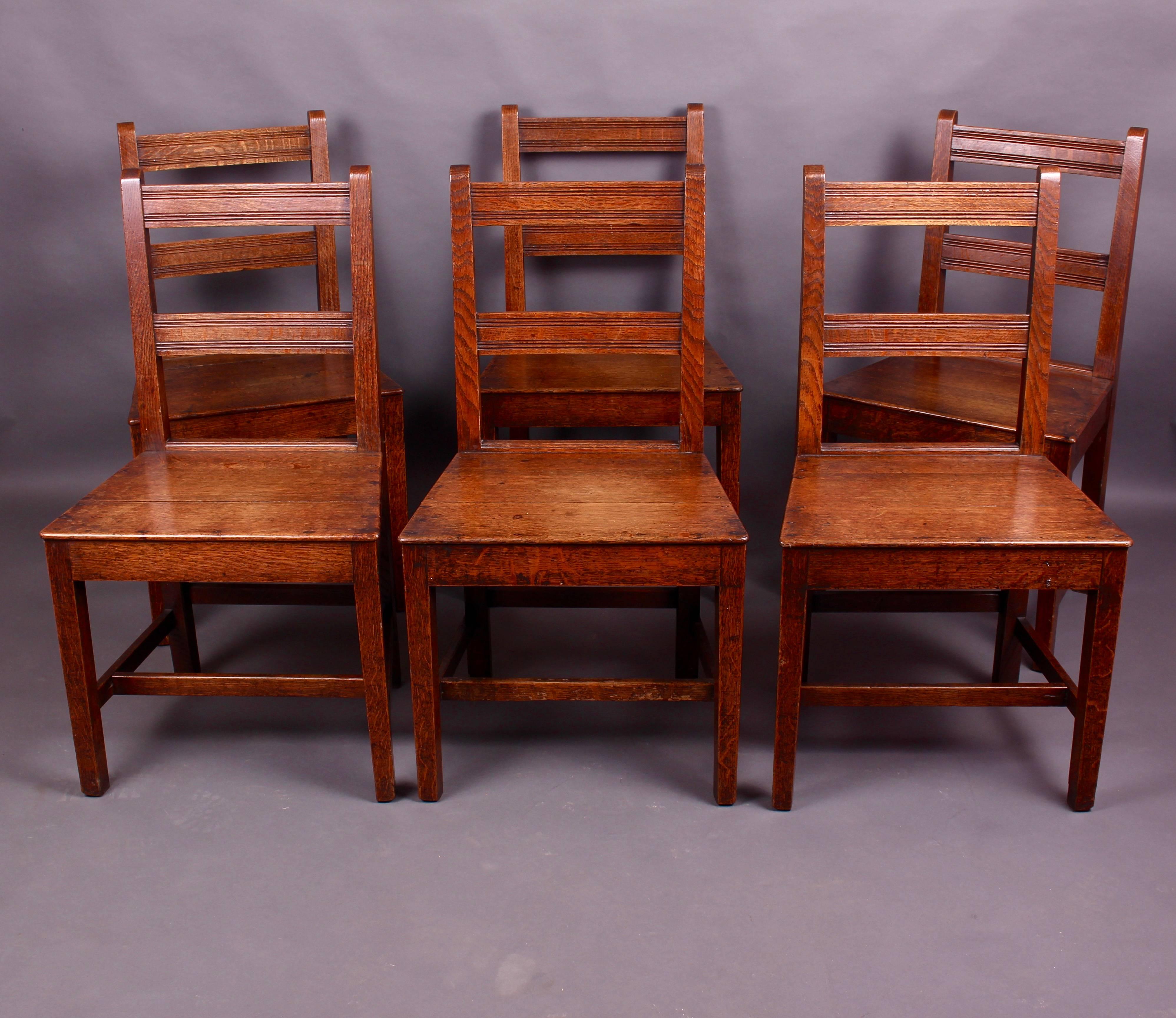 A delightful set of six Edwardian country oak dining chairs. Having the most wonderful colour and patina. The Quaker like design with its simple lines make these chairs both functional and stylish. Would suit a modern or traditional setting. They