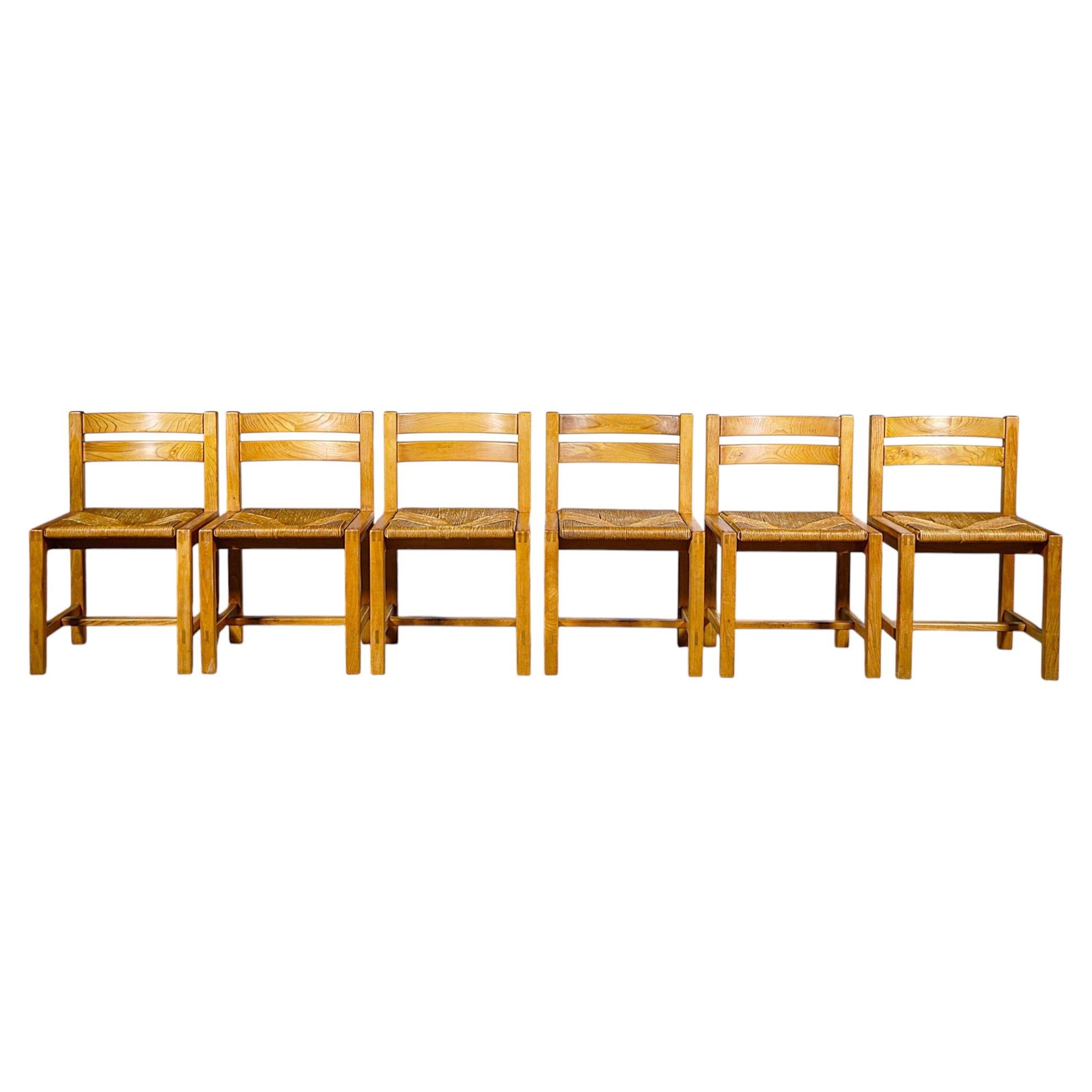 Lot de six chaises en bois d'orme de la marque Maison Regain, France, années 1980 en vente