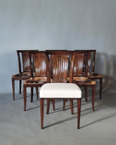 A Set of Six French Art Deco Mahogany Dining Chairs by Gaston Poisson