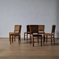 A Set of Six French Oak and Woven Seagrass Dining Chairs