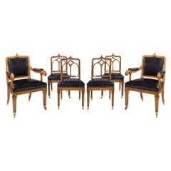 A set of six Gothic oak dining chairs