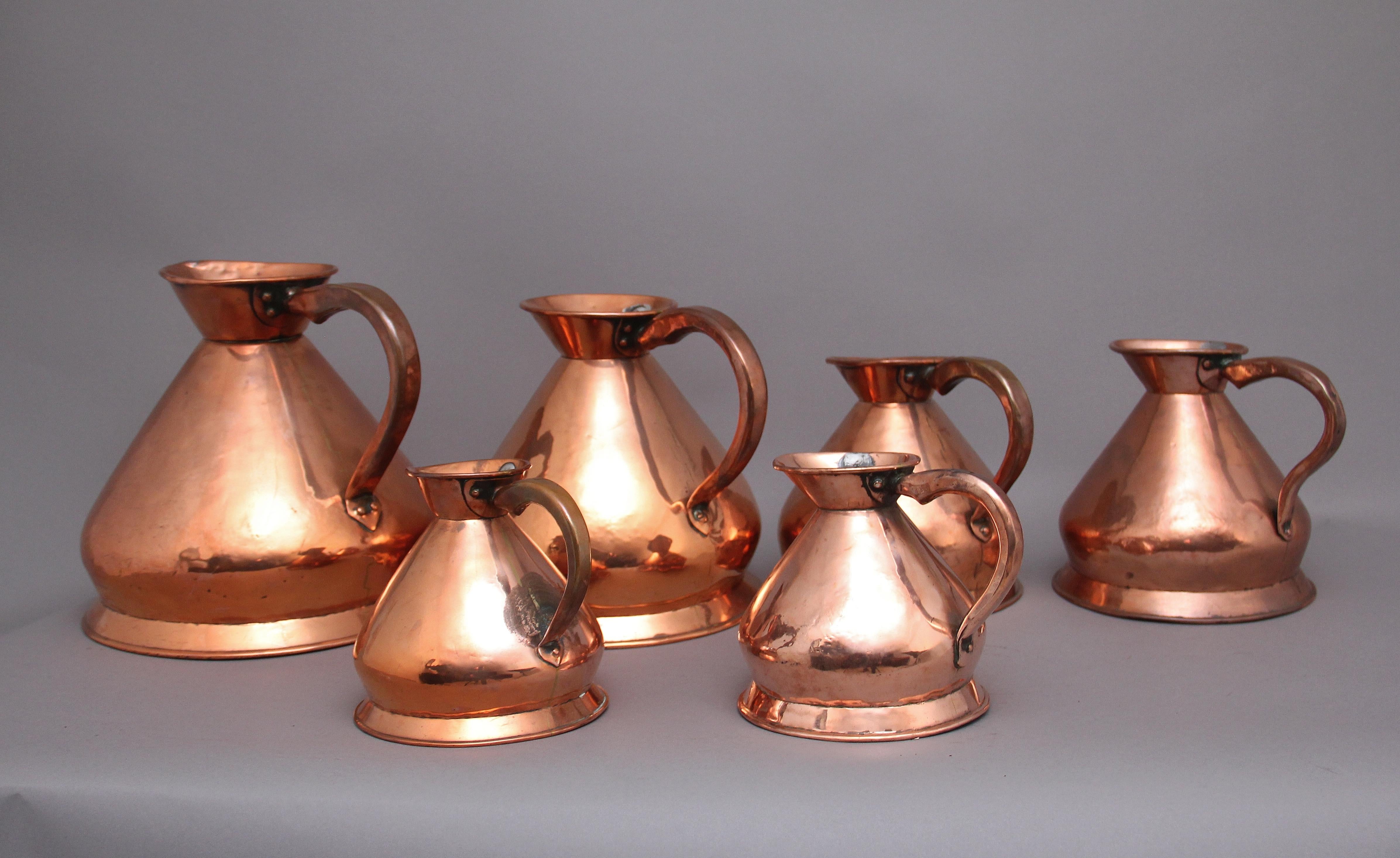 A set of six highly decorative 19th Century copper measuring jugs, all in very good condition and are marked by how many gallons each one have, in the collection there are 1 x three gallons, 1 x two gallons and 2 x one gallon and two x 1/2 gallons. 