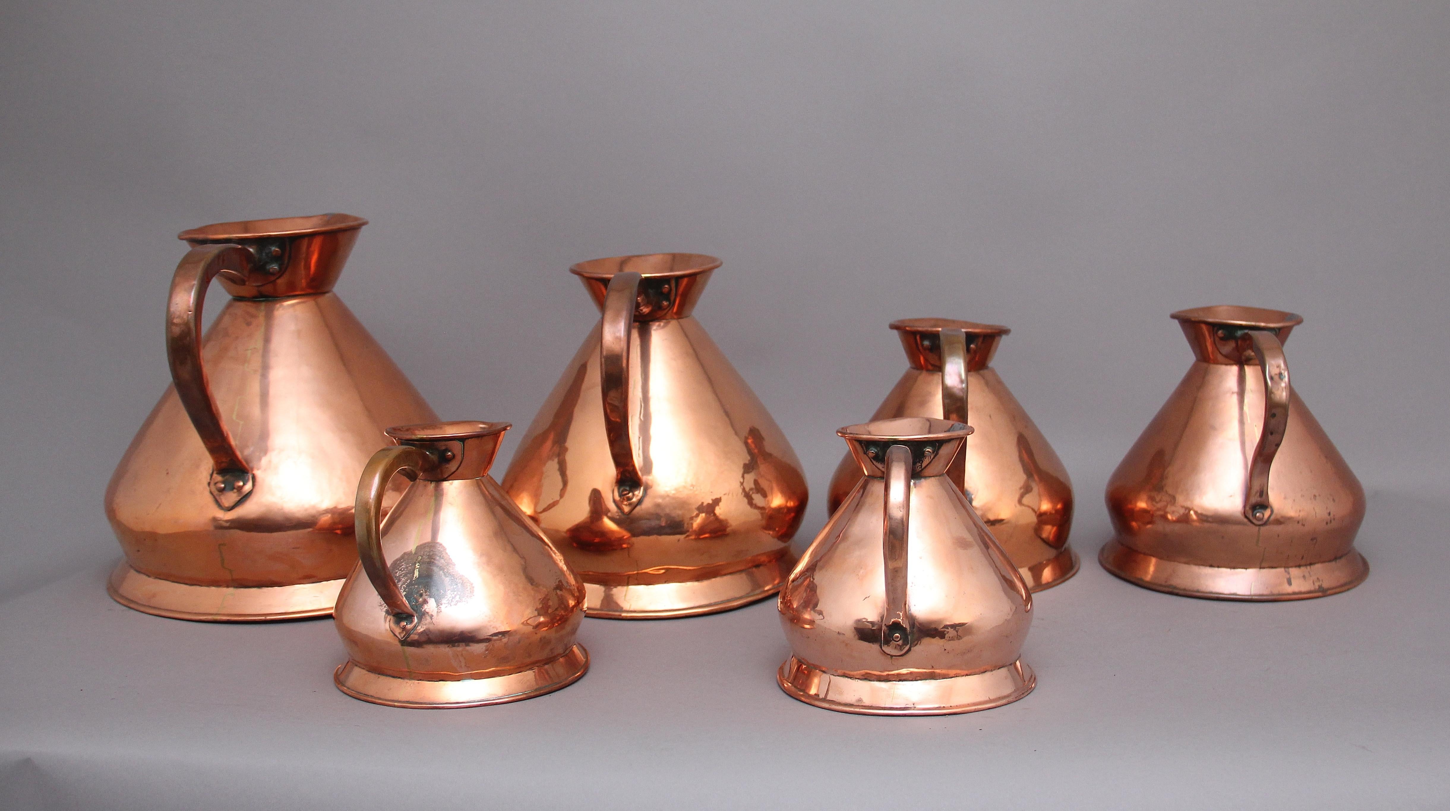 Victorian A set of six highly decorative 19th Century copper measuring jugs For Sale