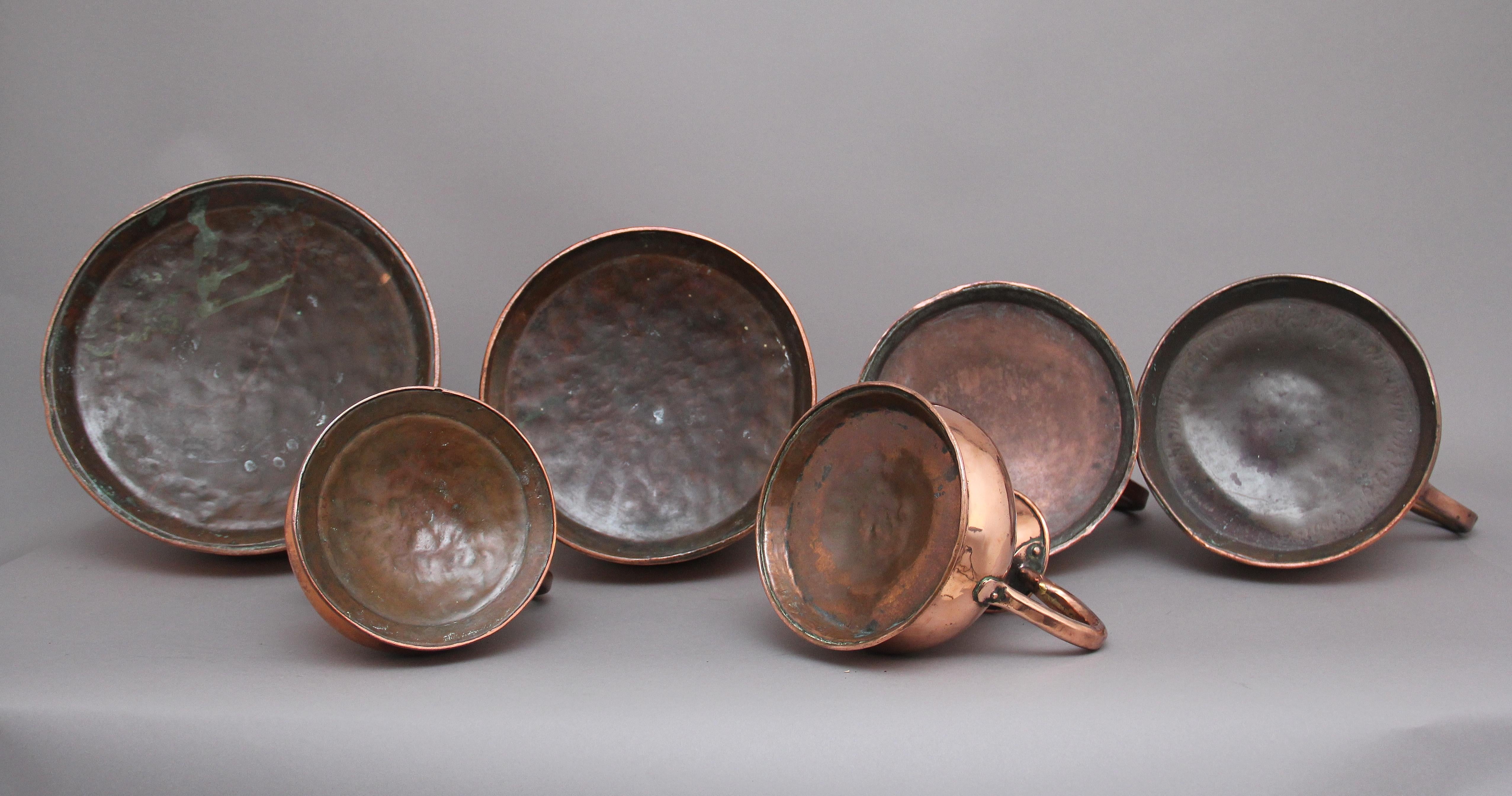 Copper A set of six highly decorative 19th Century copper measuring jugs For Sale