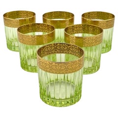 A set of six Italian Artemisia green crystal tumblers with 24 ct gold decoration