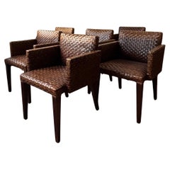 A Set of Six Italian Chairs With Woven Leather Covers