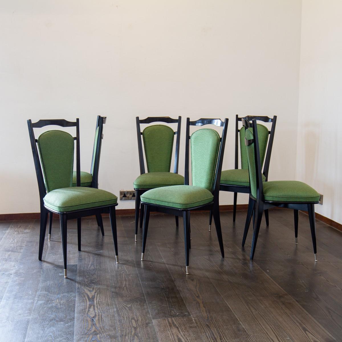 A set of six Italian, black framed dining chairs with nickel capped feet, upholstered in a vibrant green, 1950s.