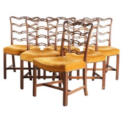 A Set Of Six Ladder-Back Dining Chairs