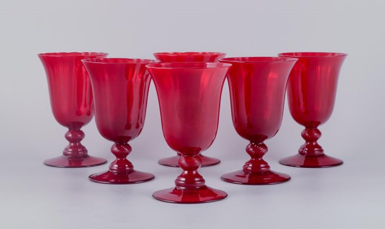 A set of six large wine glasses in red glass.
Sweden.
Late 20th century.
Perfect condition.
Dimensions: H 14.8 cm x D 9.6 cm.