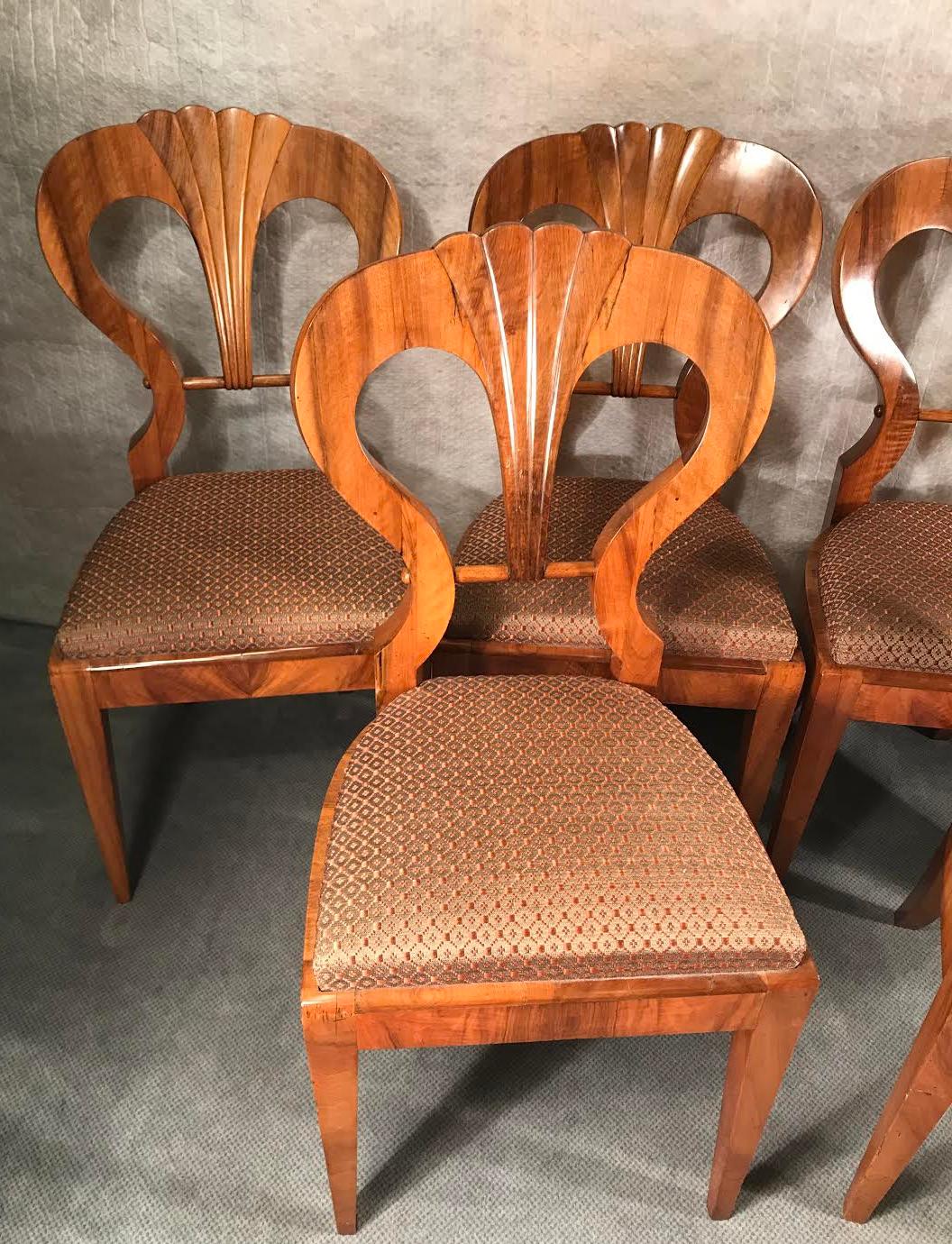 This beautiful set of six biedermeier chairs dates back to around 1820 and comes from Vienna. The chairs are attributed to Josef Danhauser. 
Their design can be found on the original design drawings of the Danhauser furniture workshop which are