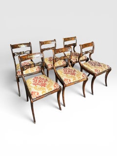 A set of six Regency faux rosewood brass inlay dining chairs
