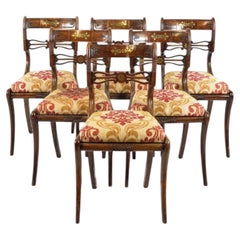 A set of six Regency faux rosewood brass inlay dining chairs