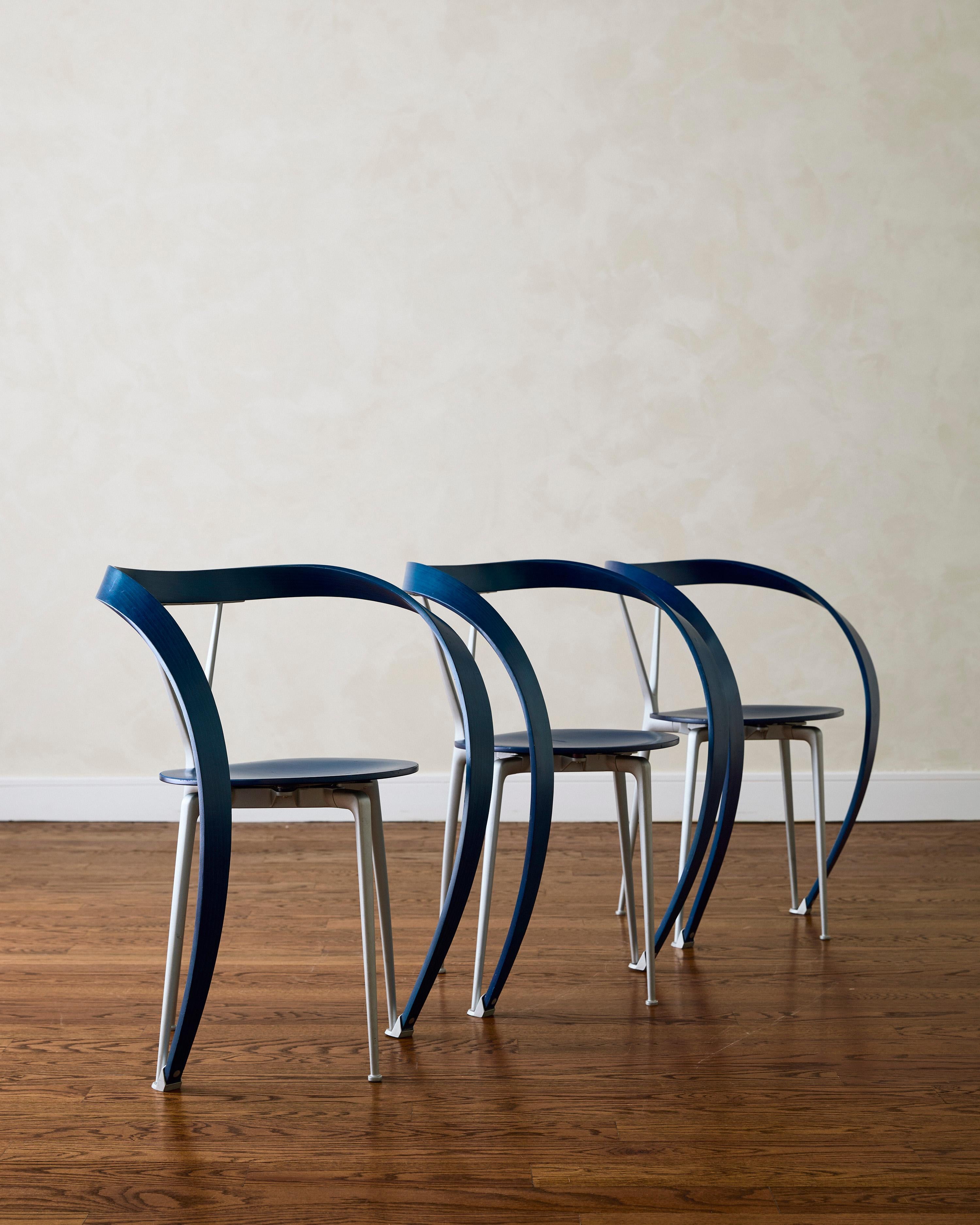 Set of six 'Reverse' dining chairs by Andrea Branzi for Cassina (1993), featuring solid stained beechwood armrests and backrests, paired with a gray anodized steel frame.


