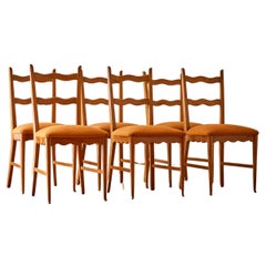 A set of six scalloped dining chairs attr. to Paolo Buffa