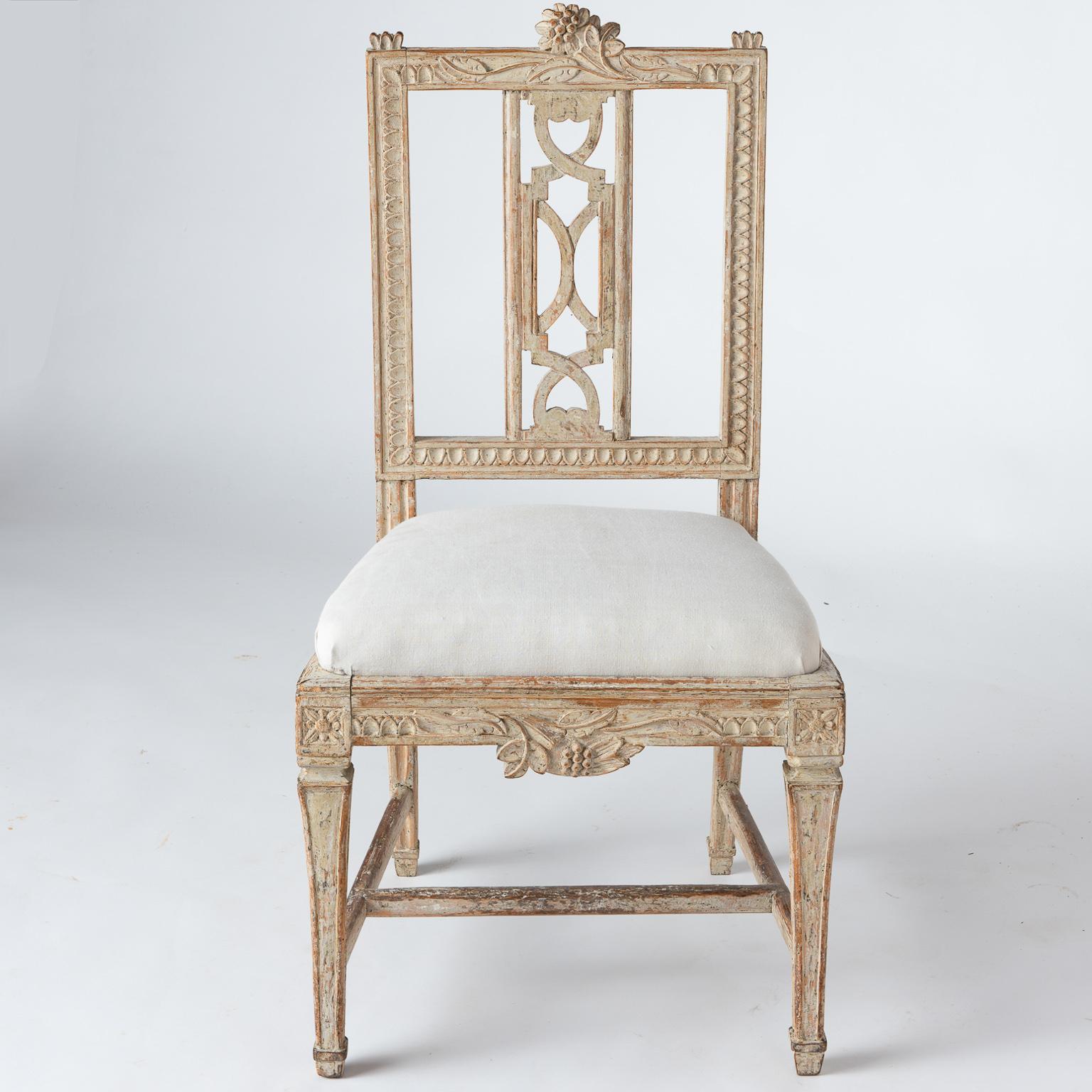 These beautifully crafted chairs were designed by Carl Wilhelm Carlsberg, a noted chair maker in Lindome Sweden, in the 18th and early 19th century. This model of chair was created for the dining room at the Gunnebo Manor House outside of