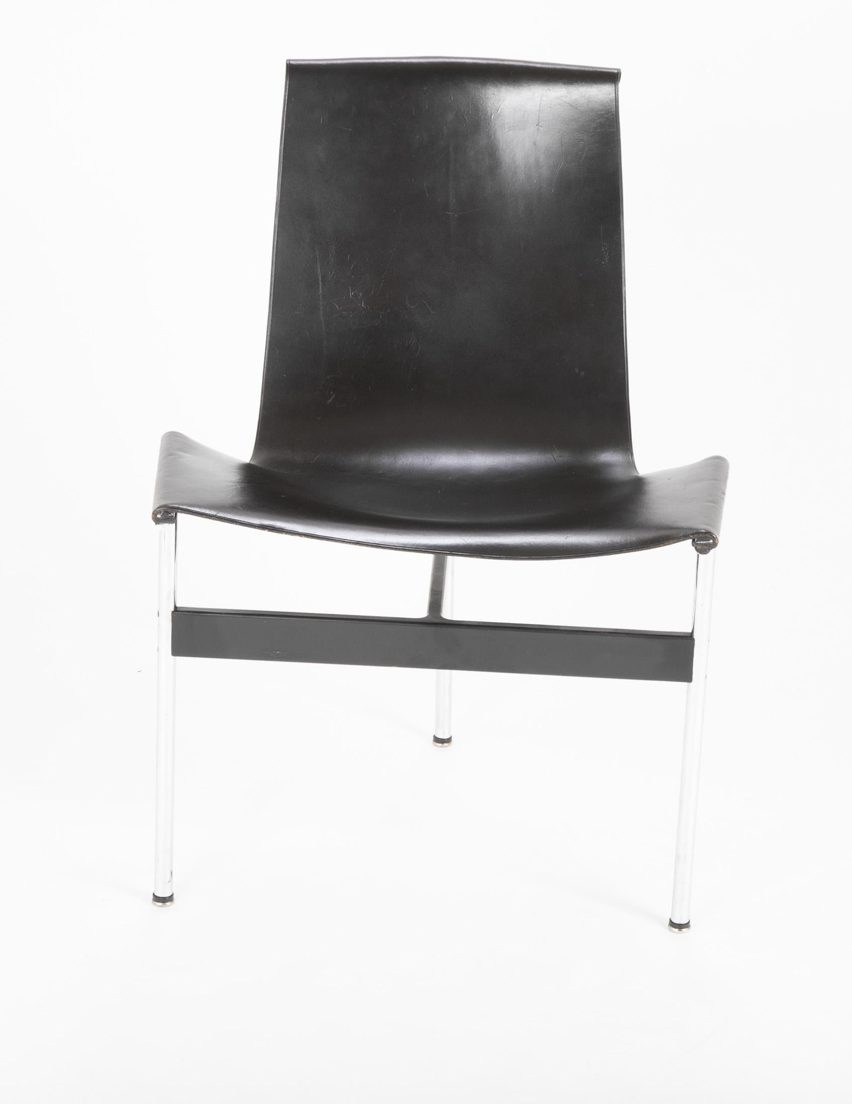 A set of 6 black leather and polished chrome T dining chairs designed by Douglas Kelly, Ross Littell and William Katavolos. Original leather in good condition.