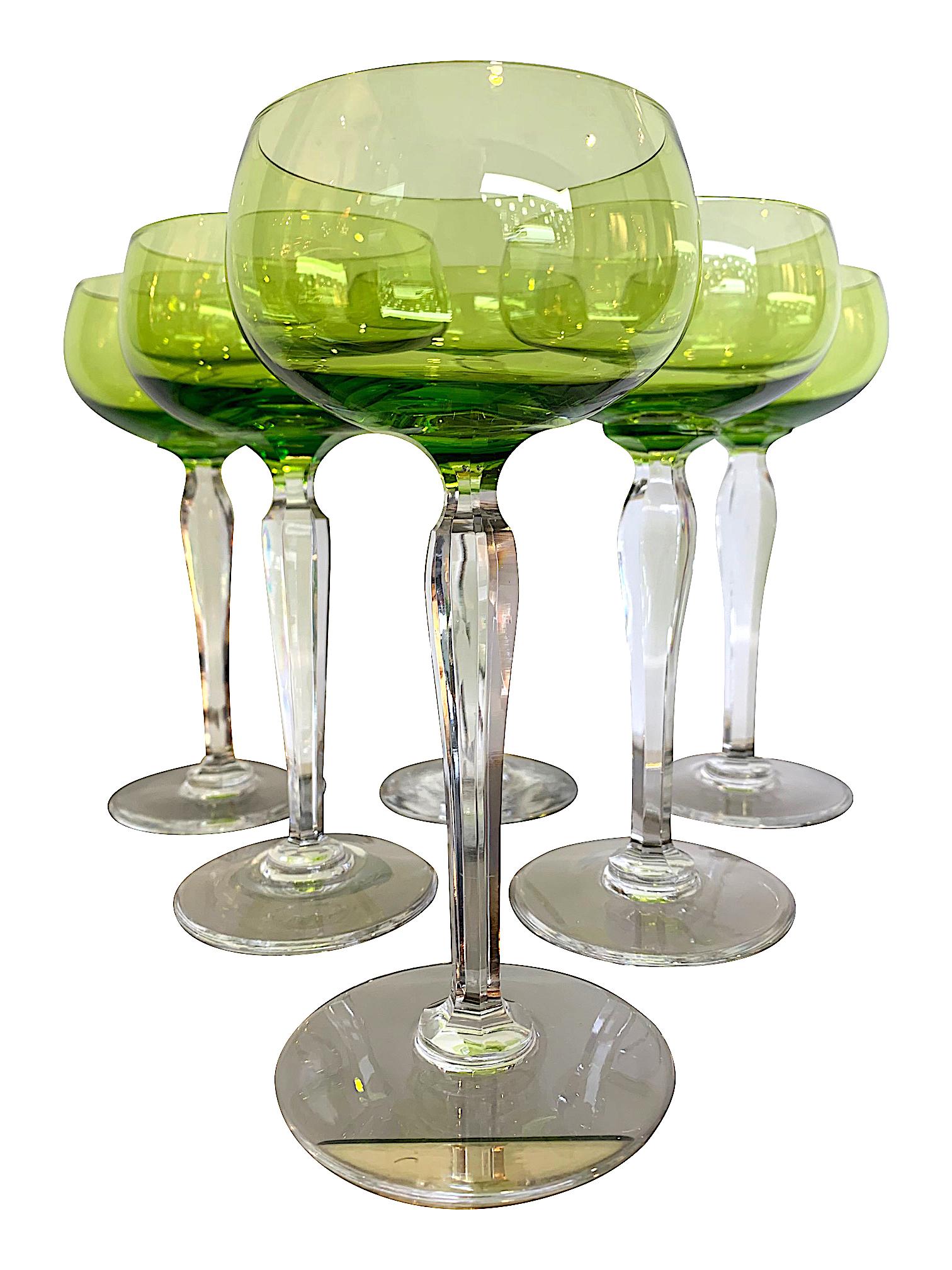 A set of six Val Saint Lambert green crystal hock glasses with cut faceted crystal stems. These are very elegant tall glasses and could be used for Champagne or cocktails. 

 “Hock” is an old-time word for German white wine, but you can use this