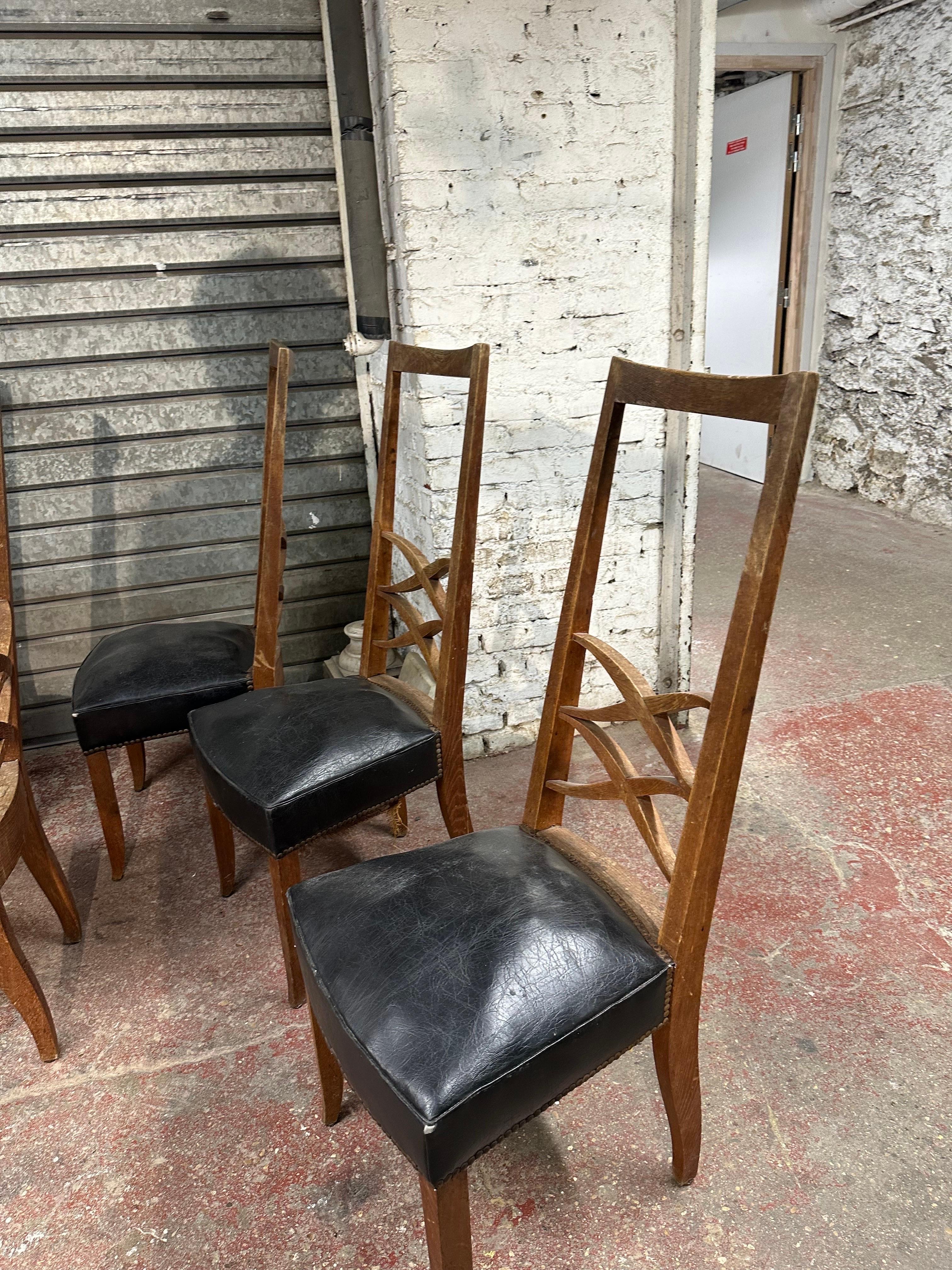 Set of ten chairs in oak needed to be reupholstered.