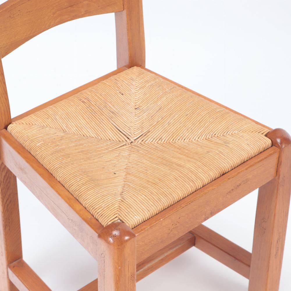 Each with a three arched slats, above a rush seat supported by square straight legs joined by an H-stretcher. A simple, but elegant look.