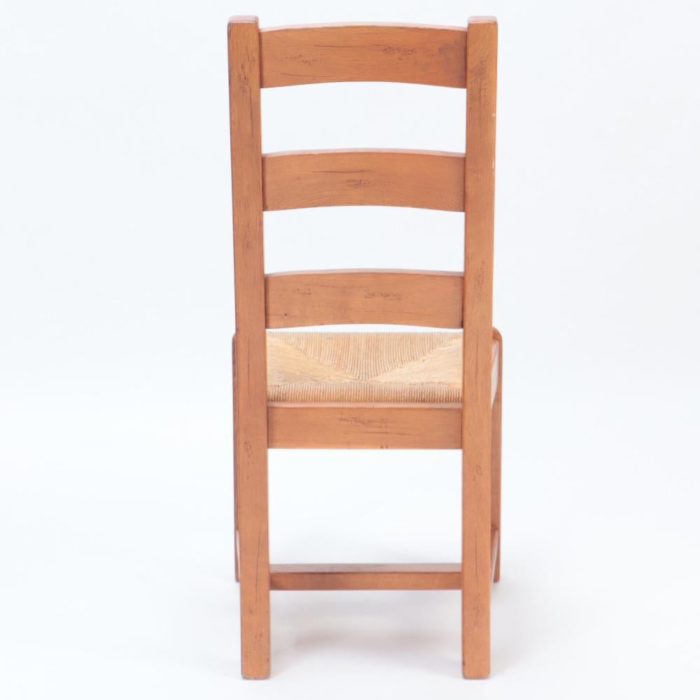 A set of ten French oak ladderback side chairs, C. 1960. In Good Condition For Sale In Philadelphia, PA