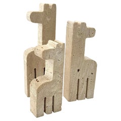 A set of three 1970s Fratelli Manelli travertine giraffes